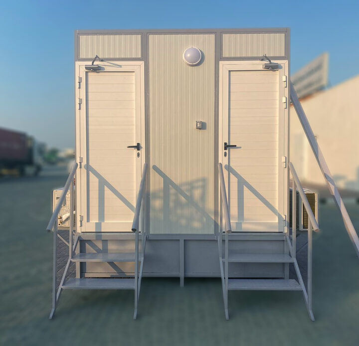 Twin prefabricated portable toilet in the shadow